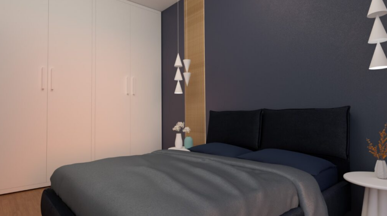 Camera matrimoniale con armadi bianchi, parete blu notte e lampade a sospensione di design.