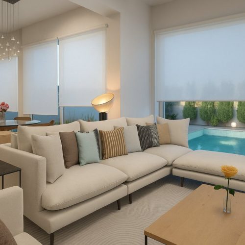 Zona giorno con divano angolare e piscina esterna, arredo su misura a Dubai