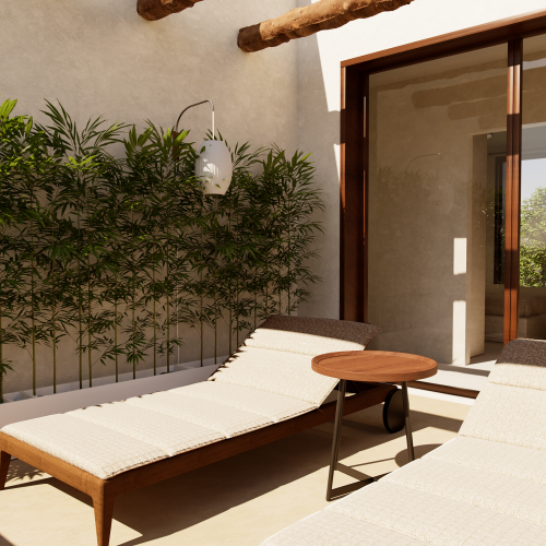 Zona relax privata con lettini in legno e parete vegetale, balcone di una villa AD2 Habita a Zanzibar.